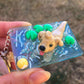 Dog chasing ball polymer clay resin keychain art